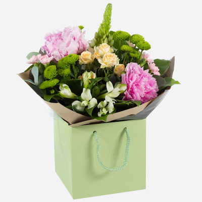 Delicate Touch - Subtle and sweet is the aura of this handtied. Containing a mixed collection of seasonal flowers and peonies.