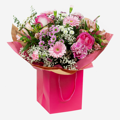 Rosemary - A pink themed hand-tied created in a complimentary gift bag or box. A special gift they’ll remember for years to come.
