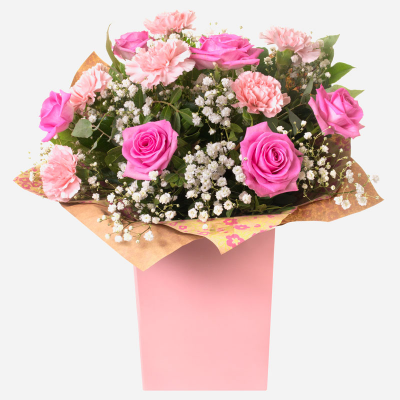 Roses & Ruffles

 - Pink Roses and Carnations make this gift timeless and classic
