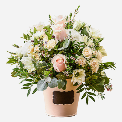 Dawn - An inspiration from nature . A flower gift perfectly arranged in a container using pale shaded flowers and foliage.