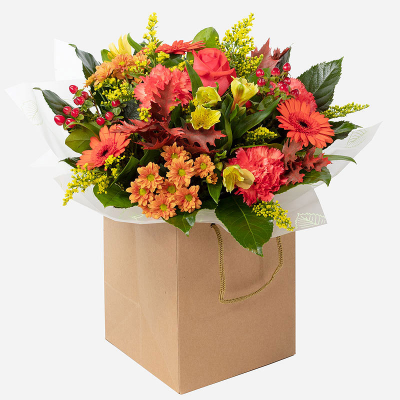 Honey & Spice - Autumn holds some of the most stunning blooms of the year, which can be seen in our beautiful Autumn Sunset hand-tied, featuring a collection of seasonal flowers and foliage that are perfect for any occasion.   